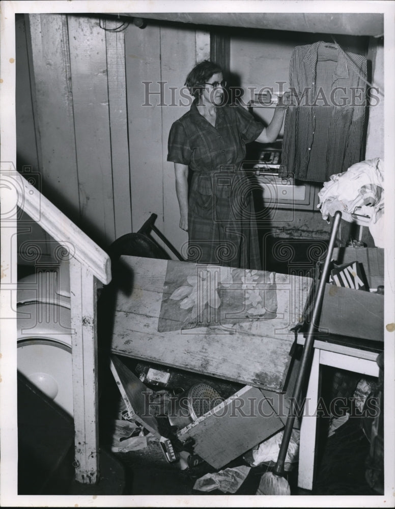 1956 Press Photo Mrs William Schultz at her flooded Cleveland home