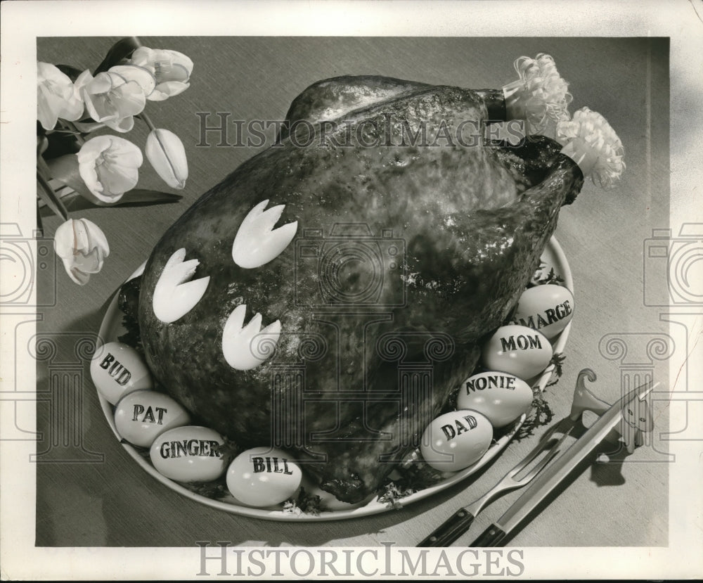 1956 Press Photo Decorations and Family Member named eggs for Easter turkey