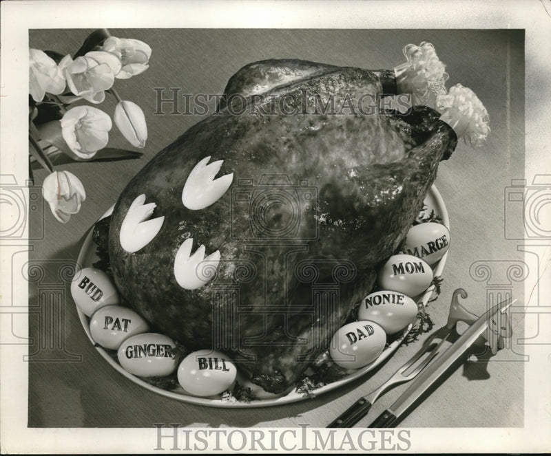 Load image into Gallery viewer, 1956 Press Photo Decorations and Family Member named eggs for Easter turkey
