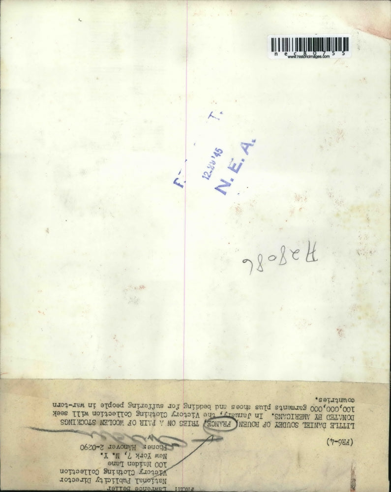 1945 Press Photo Little Daniel Soudey of Rouen France tries pair of woolen socks