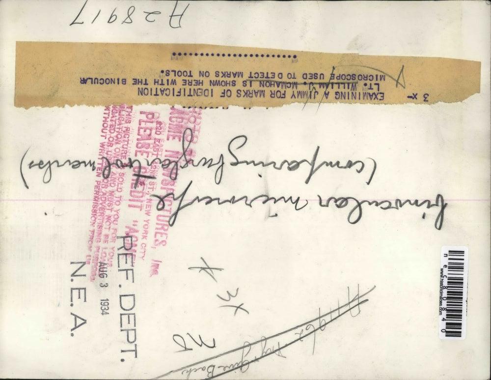 1934 Press Photo Lt William J McMahon examining a Jimmy for Identification