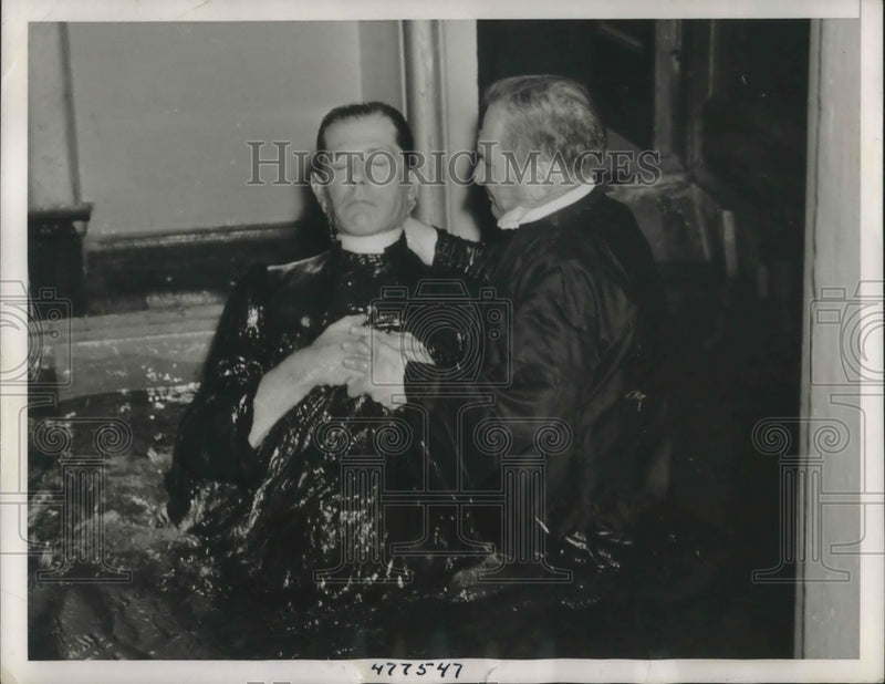 Load image into Gallery viewer, 1938 Press Photo Rev. Alexander Lowande baptizes Rev. Rudolf Janssen
