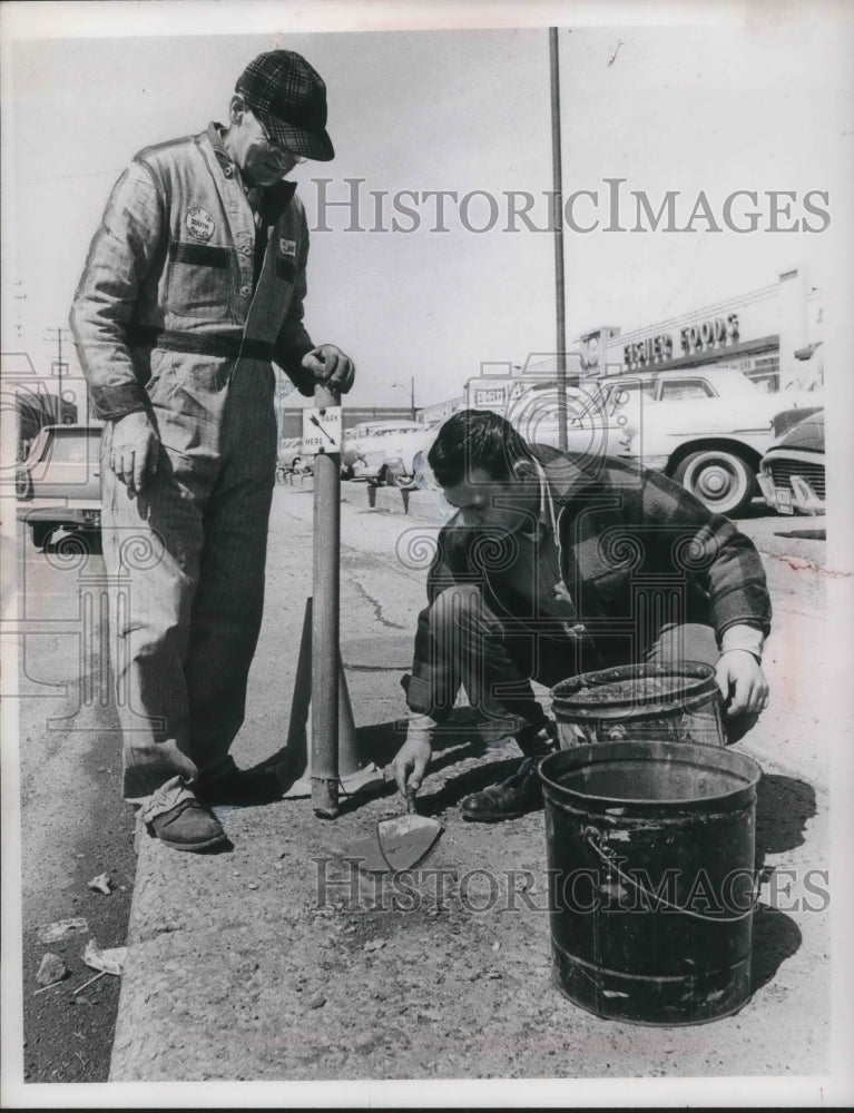Load image into Gallery viewer, 1966 Press Photo Louis Wagner &amp; Bob Burns making repairs to a road in Cleveland
