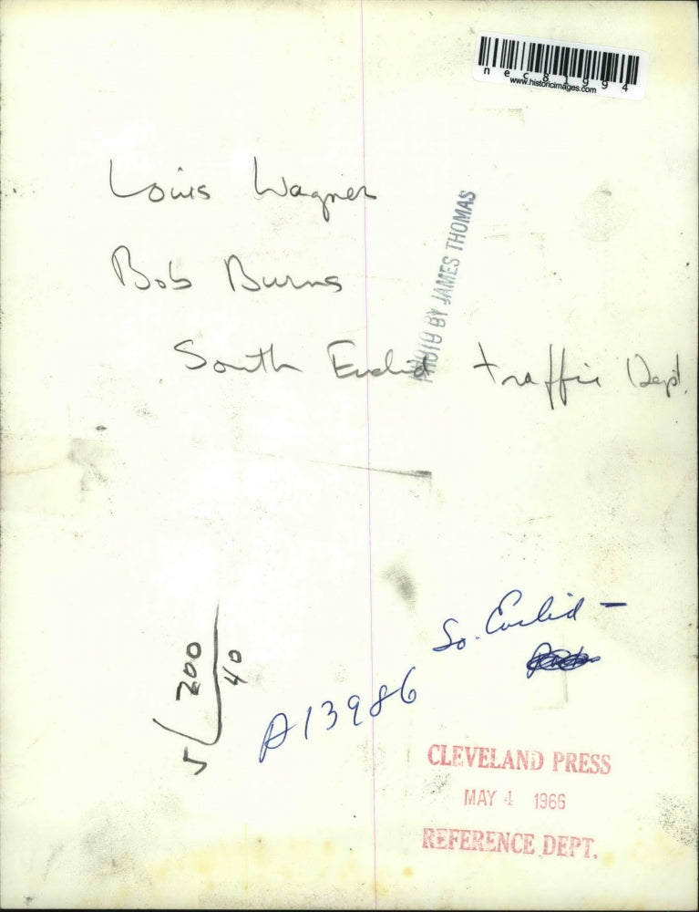 1966 Press Photo Louis Wagner & Bob Burns making repairs to a road in Cleveland