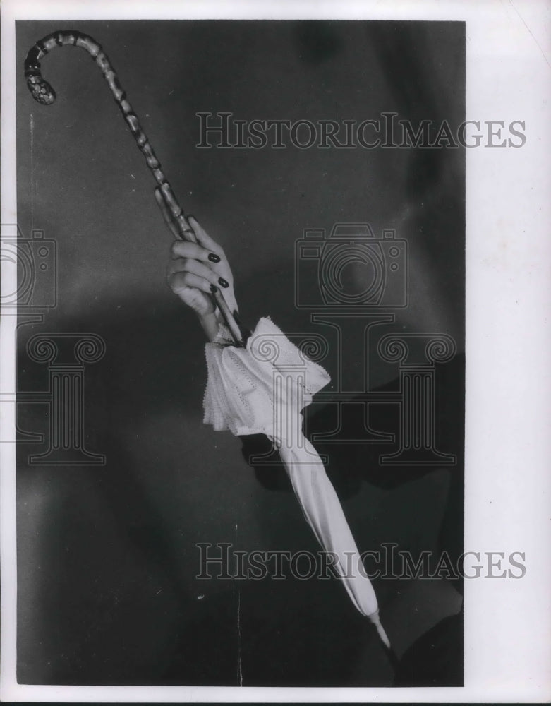 1952 Press Photo A model displaying an umbrella in fashionable colors