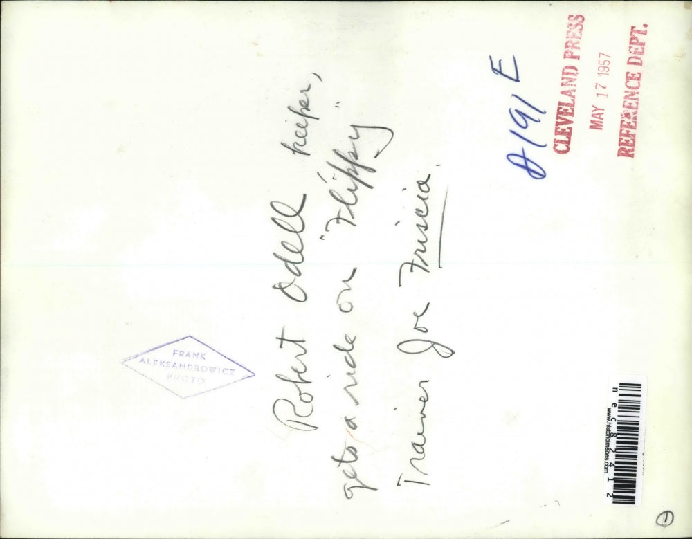 1957 Press Photo Robert Odell, keeper gets to ride on "Flippy" the elephant