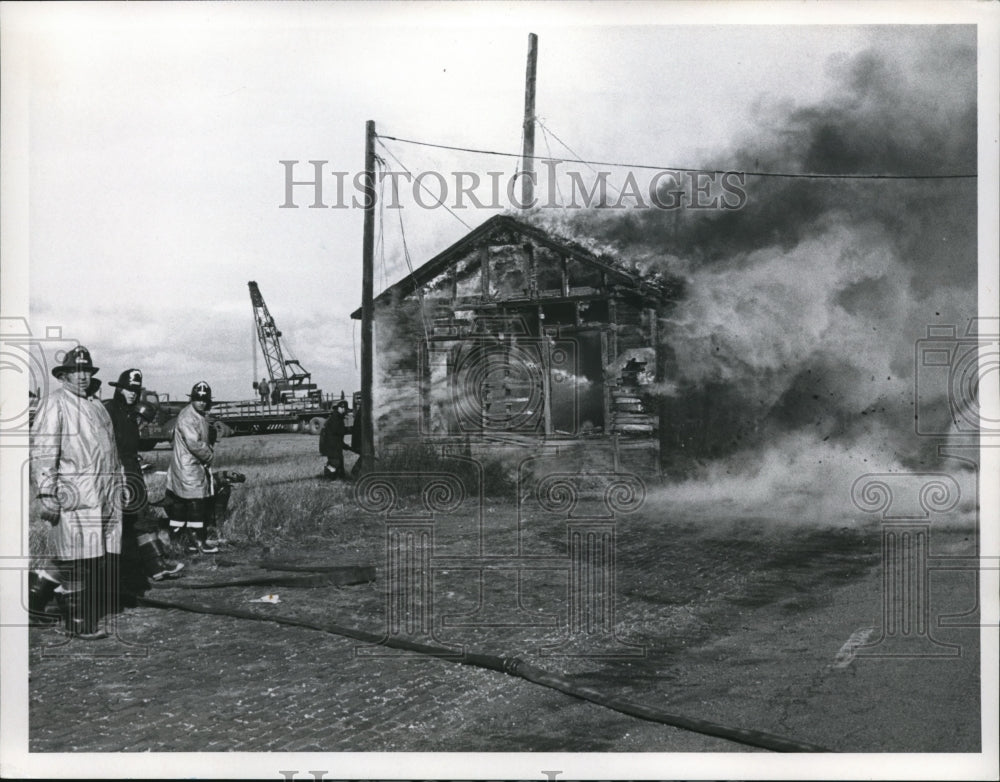 Press Photo Firemen Working a Fire at Old Shack