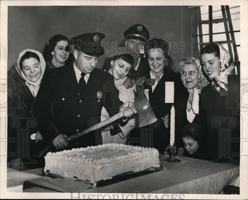 Load image into Gallery viewer, 1949 Press Photo Joseph McFarland, Fireman Axing Cake
