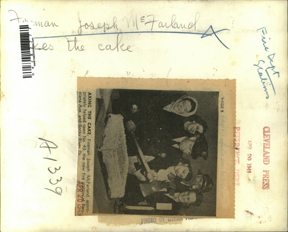 1949 Press Photo Joseph McFarland, Fireman Axing Cake