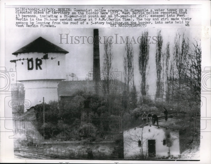 Load image into Gallery viewer, 1961 Press Photo East Berlin cops dismantle water tower used for escape to west
