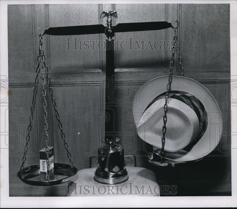 Load image into Gallery viewer, 1956 Media Photo Cigarette on left &amp; hat on right of the balance scale

