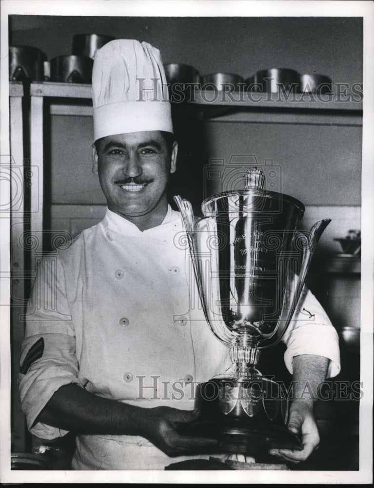 Load image into Gallery viewer, 1957 Press Photo Cpl G Sotirov holding his trophy after winning Nco Army Cooking
