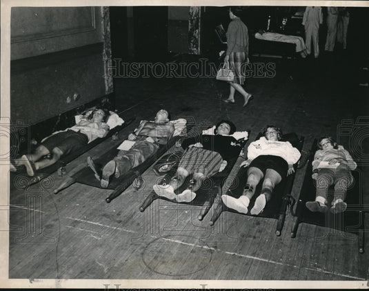 Press Photo Injured on Stretchers Ready to be Put into Ambulances