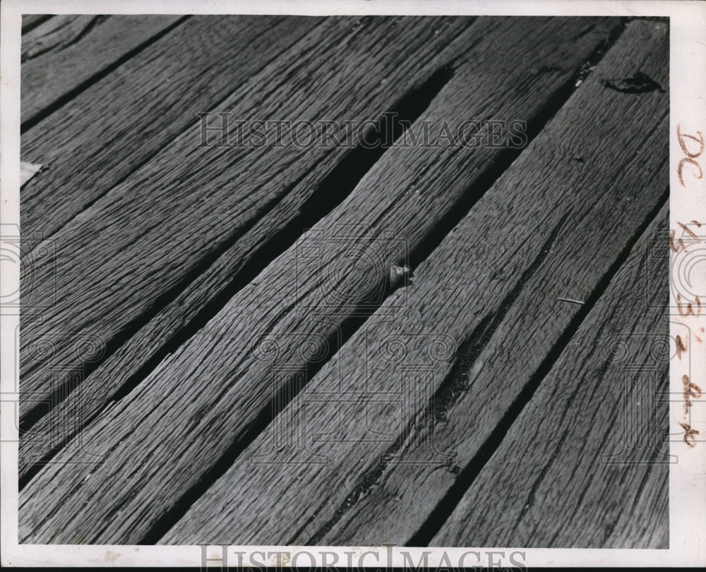 Press Photo Split & rotted boards at a camp need repair & replacement