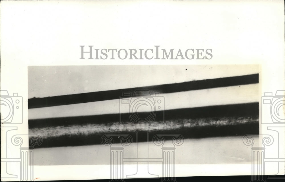 1931 Press Photo Wire compared to hair in a magnified view