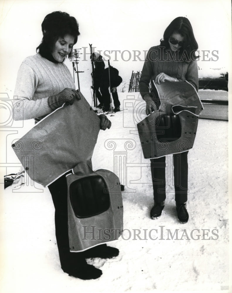 Load image into Gallery viewer, 1970 Press Photo St Moritz Switzerland women with snow slider pants
