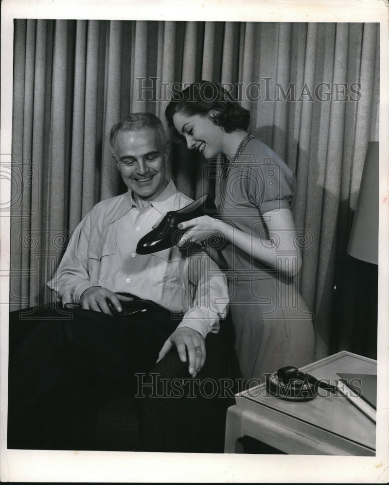 Load image into Gallery viewer, 1961 Press Photo A woman and shoes for a Father's Day present
