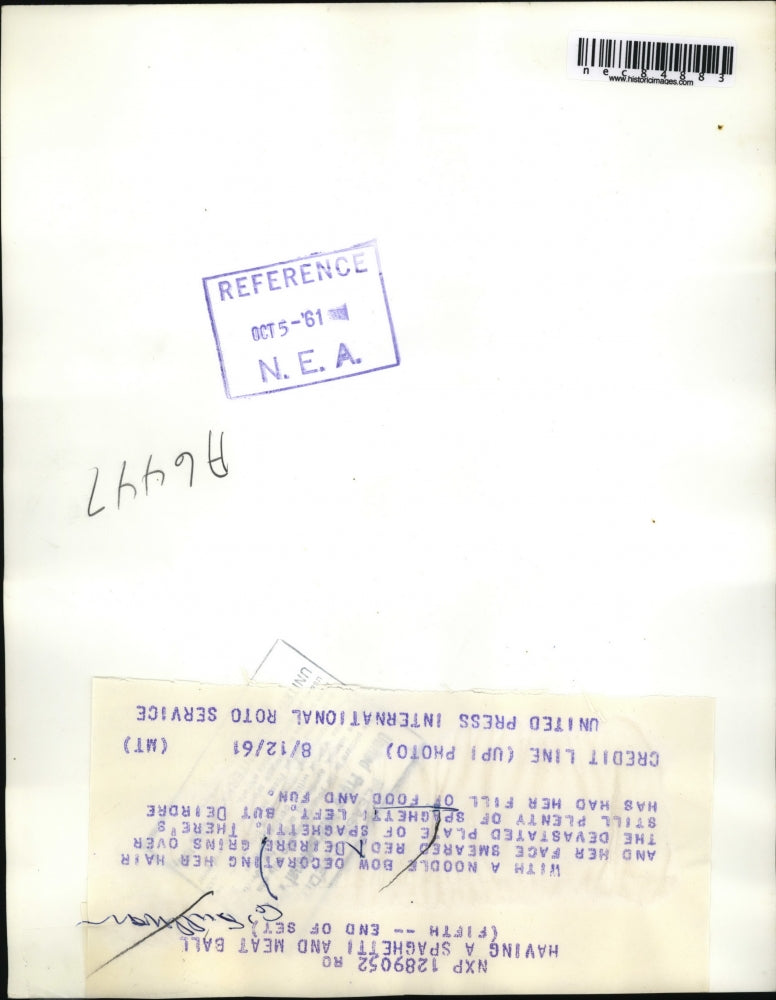 1961 Press Photo Deirdre with a noodle bow and red smeared grin had her filll