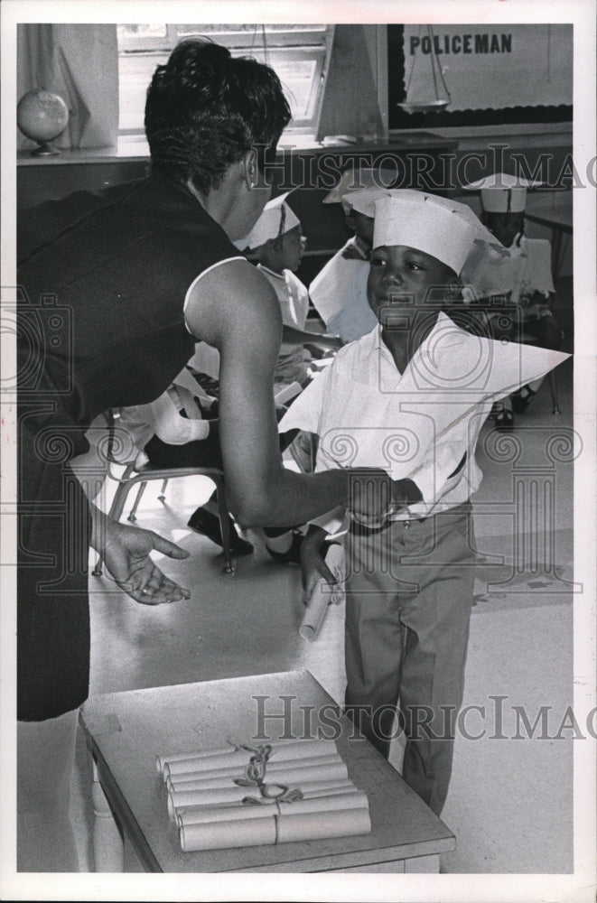 Load image into Gallery viewer, 1969 Press Photo Mrs. Ruth Brown Hands Diploma to Kenneth Thomas
