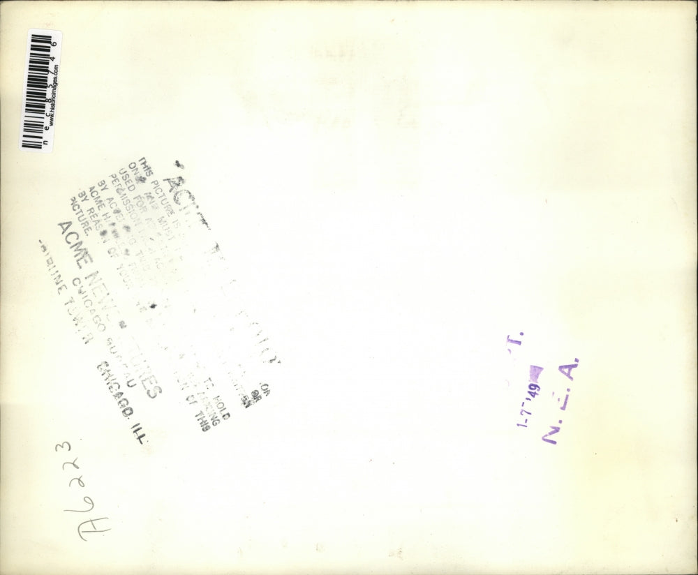 1948 Press Photo Porter James Smith pouring change into a fire helmet