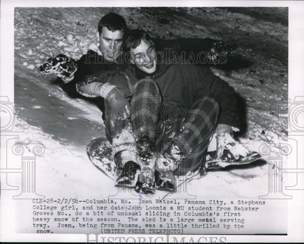 1956 Press Photo Columbia Mo Joan Wetzel & John Loomis sledding in the snow