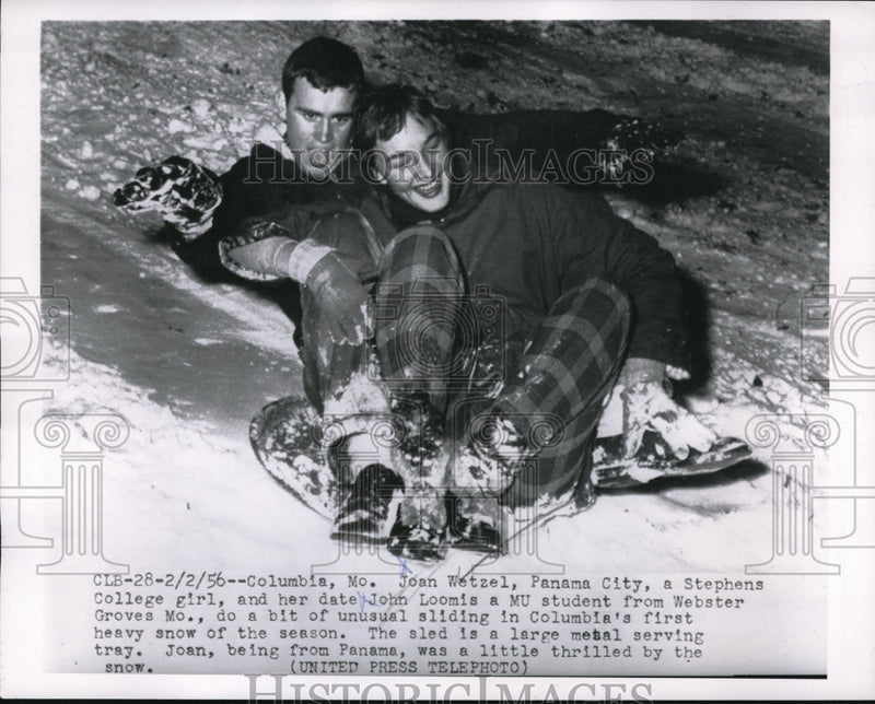 Load image into Gallery viewer, 1956 Press Photo Columbia Mo Joan Wetzel &amp; John Loomis sledding in the snow
