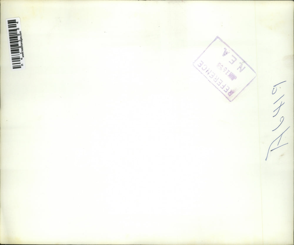 1958 Press Photo Man demonstrates early ages heat method treatment