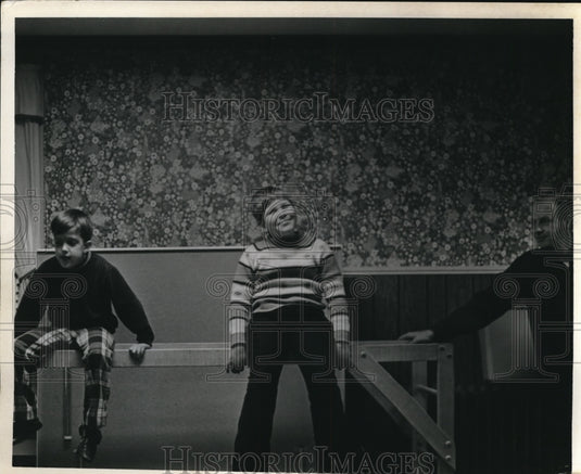 Press Photo Keith and Joey sitting in playroom bench design
