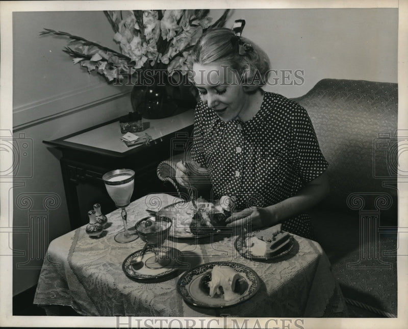 Load image into Gallery viewer, 1938 Press Photo Kallie eating fruit cup , potato &amp; bread meal

