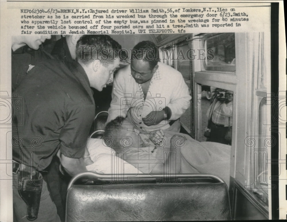 1959 Press Photo William Smith Carried off Wrecked Bus in the Bronx
