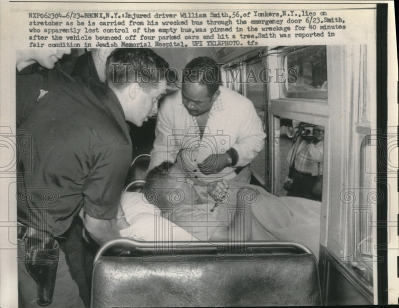 Load image into Gallery viewer, 1959 Press Photo William Smith Carried off Wrecked Bus in the Bronx
