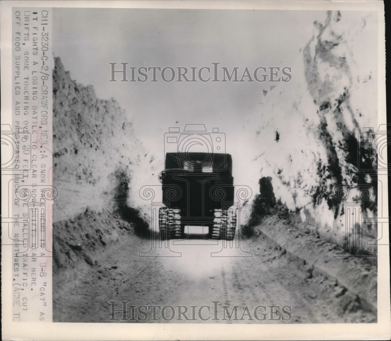 Load image into Gallery viewer, 1949 Press Photo A Snow Wall Hems In A D-8 Cat As It Fights A Losing Battle
