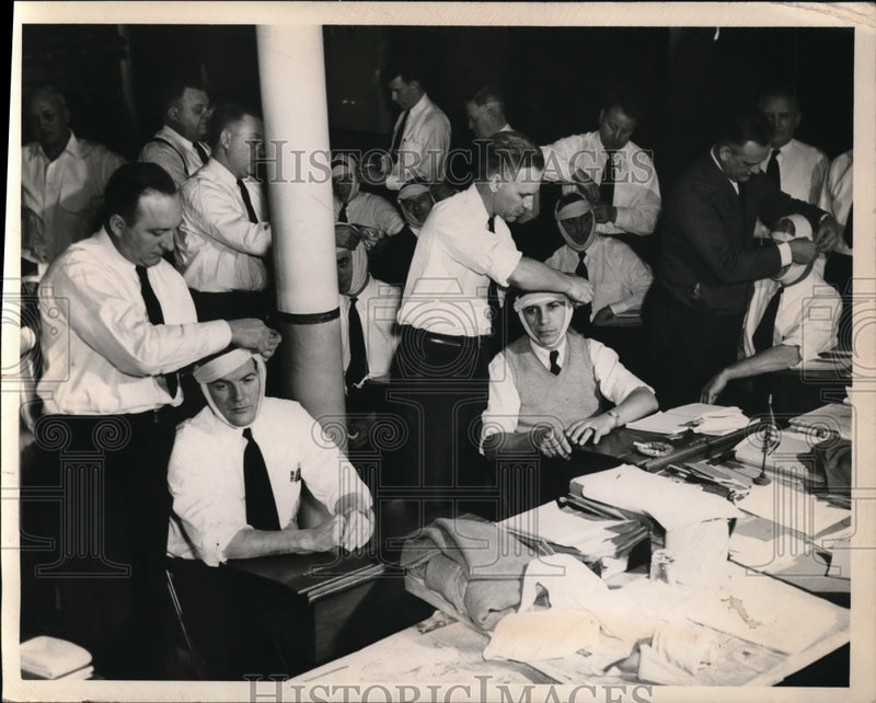 Load image into Gallery viewer, 1949 Press Photo Cleveland Fire dept Lts at a first aid class with bandages
