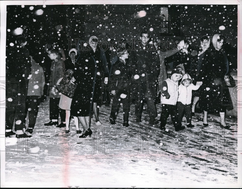 Load image into Gallery viewer, 1965 Press Photo Crowd of people walking in snow storm in Cleveland Ohio
