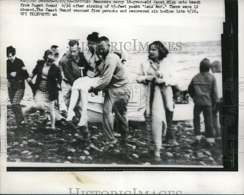 Load image into Gallery viewer, 1959 Press Photo Rescuers carry Janet Wick,16 on beach at Puget Sound
