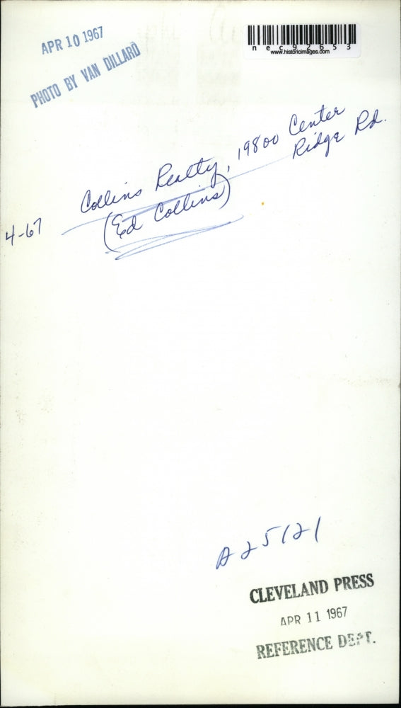 1967 Press Photo Ed Collins poses at the Collins realty signage post