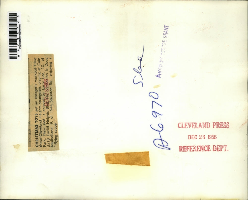 1956 Press Photo Larry Lee, Doug Mulholland sledding in Cain Park, OH