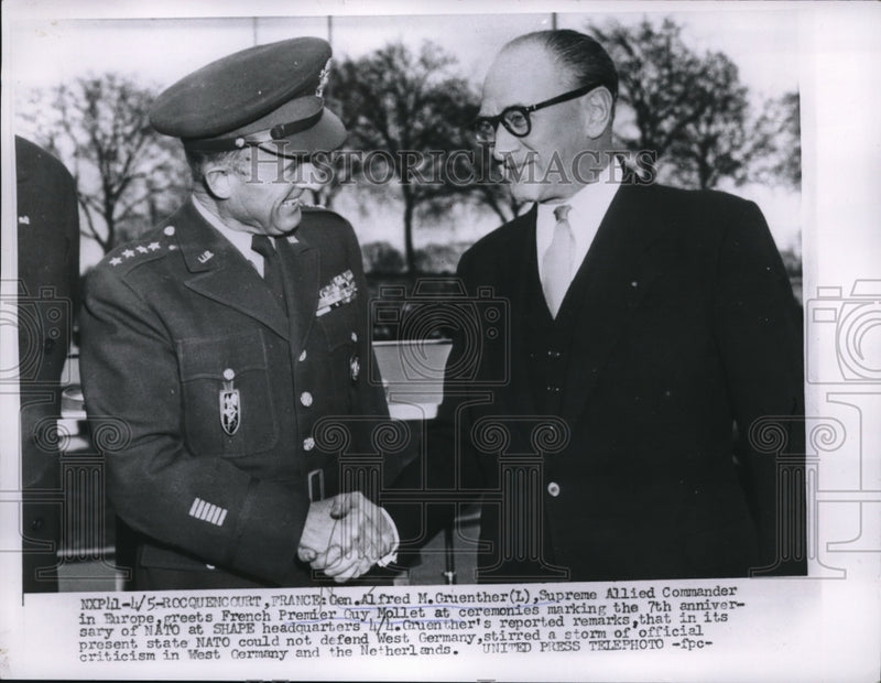 Load image into Gallery viewer, 1956 Press Photo Gen. Alfred M. Gruenther shakes hands with Premier Guy Mollet
