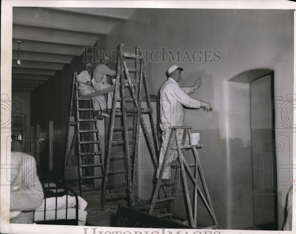 1951 Press Photo Workmen painting a building in Cleveland Ohio - nec95981