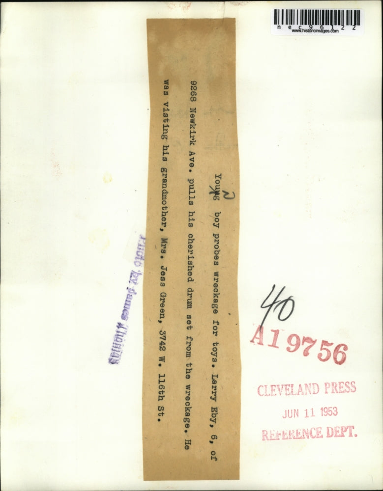 1953 Press Photo Larry Eby, 6, pulls toys from wreckage after tornado