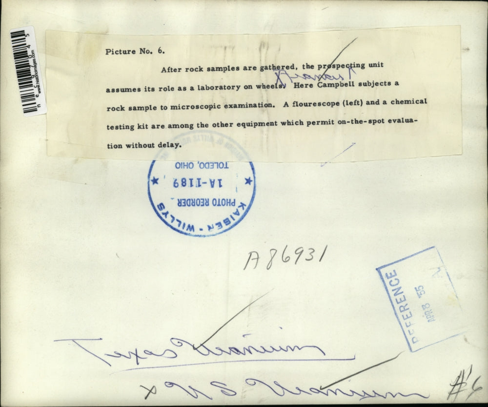 1955 Press Photo Campbell at a microscope work for a rock sample - nec97045