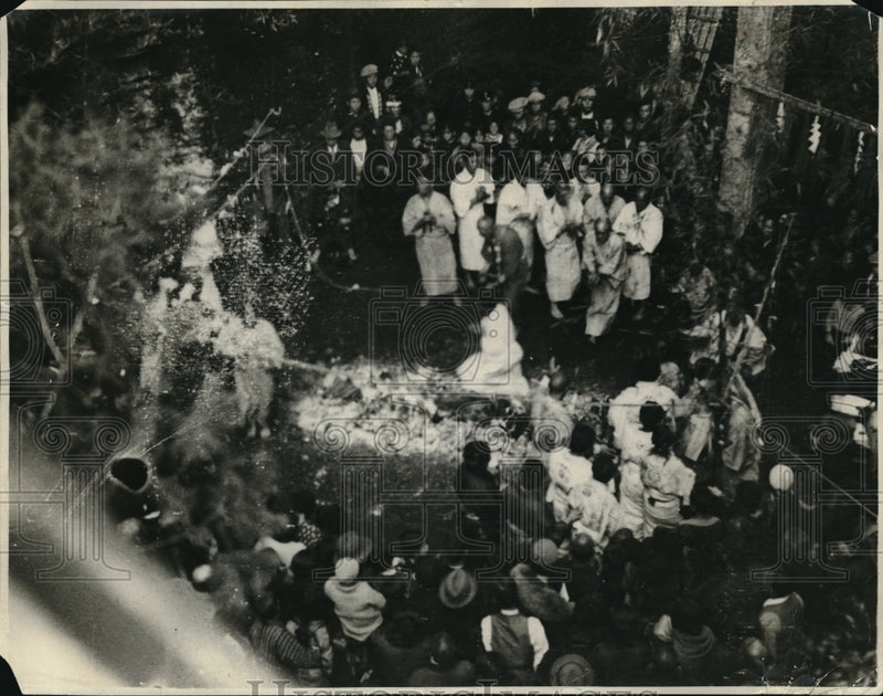 Load image into Gallery viewer, 1936 Press Photo priest walking on red hot bed of fire as crowd watches

