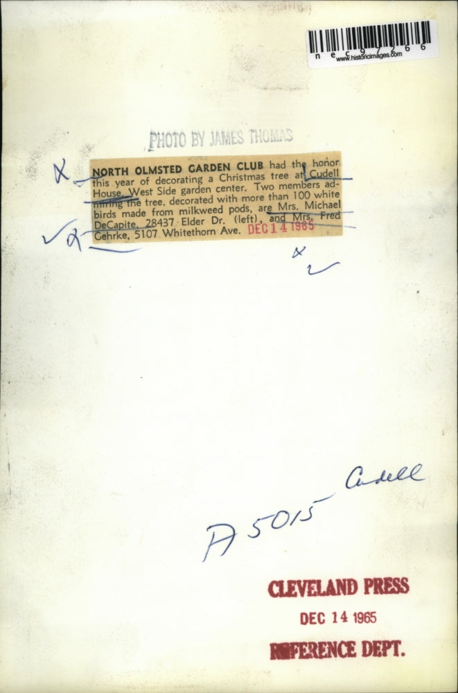 1965 Press Photo Mrs. DeCapite decorating the Christmas tree at Cudell House