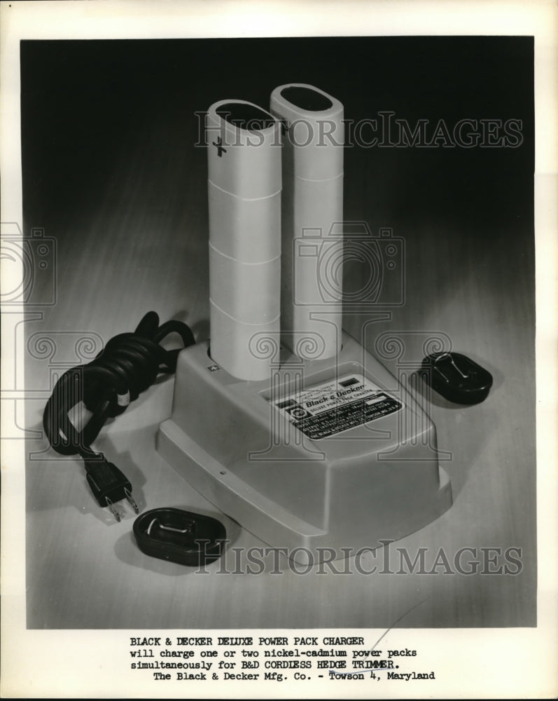 Load image into Gallery viewer, 1962 Press Photo Black &amp; Decker's deluxe power pack chargers
