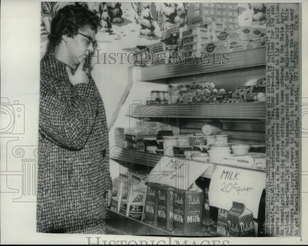 1961 Press Photo Milk prices have customers confused. - nec97981