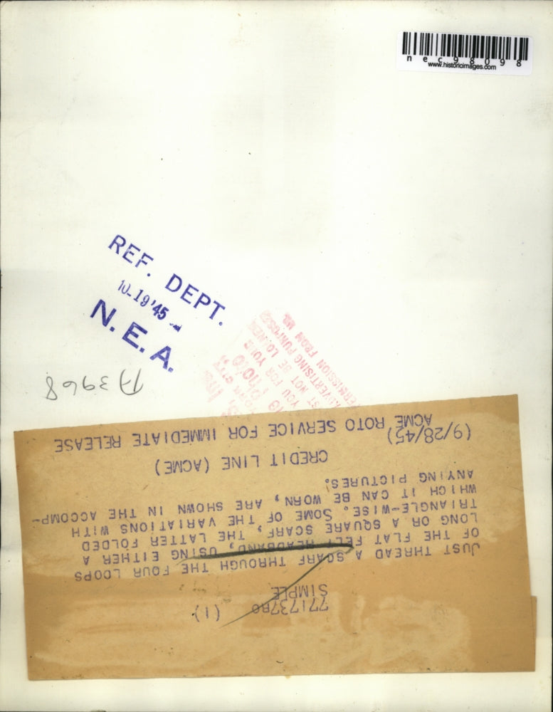 1945 Press Photo Scarf through the four loops of the flat felt headband.