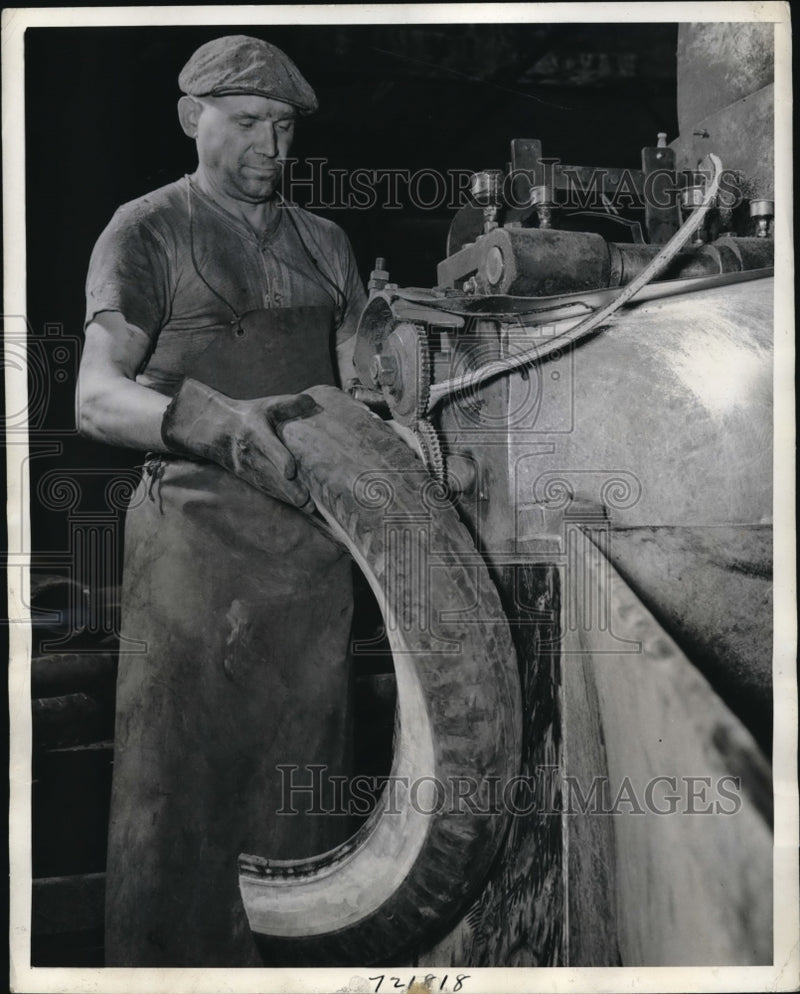 Load image into Gallery viewer, 1944 Press Photo worker reclaiming rubber at a plant in Naugatuck CT during WWII
