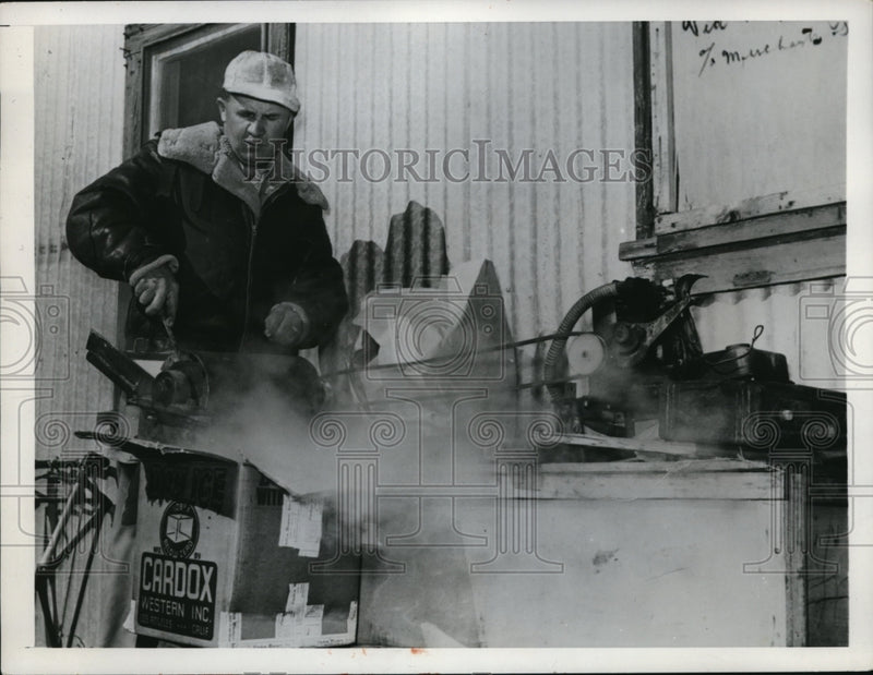 Load image into Gallery viewer, 1950 Press Photo Bob Simons a pilot grinds dry ice for a cloud seeding
