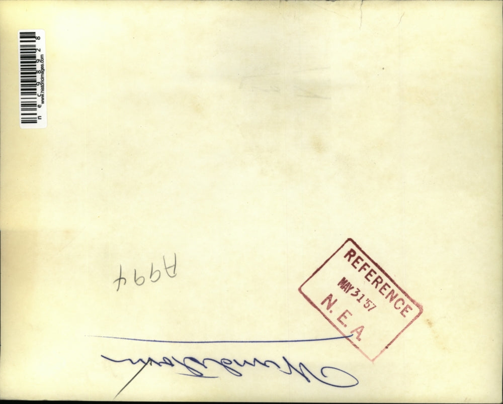 1957 Press Photo Child Standing By Uprooted Tree After Thunderstorm - nec98928