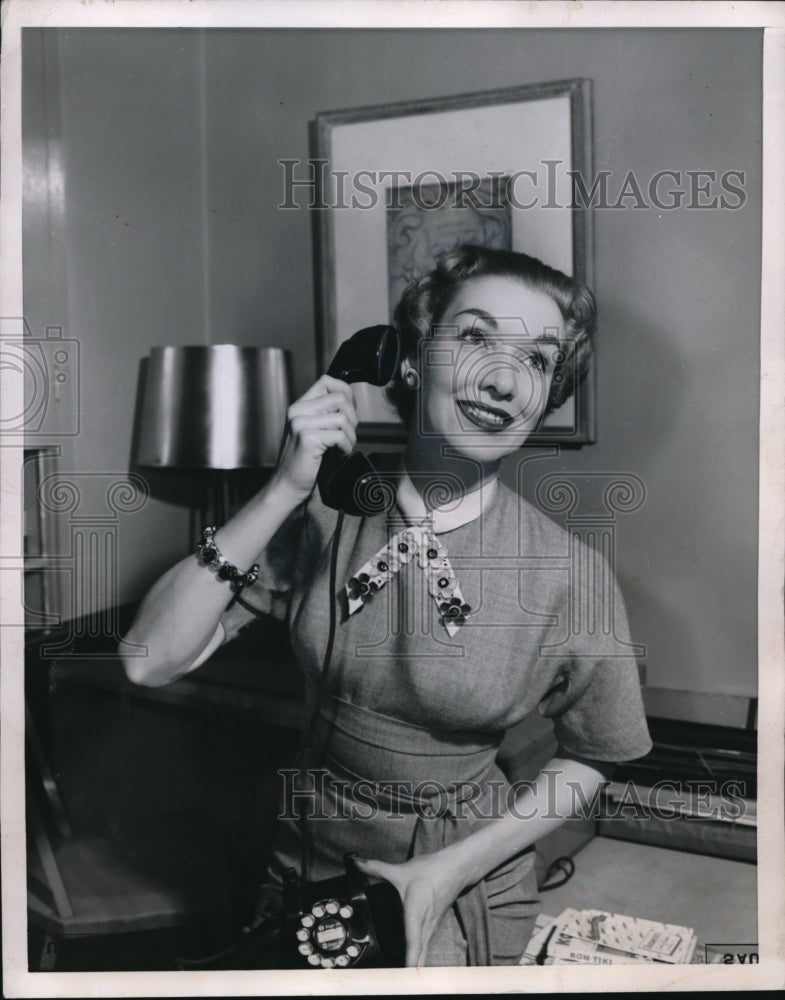 1954 Press Photo Woman using a telephone